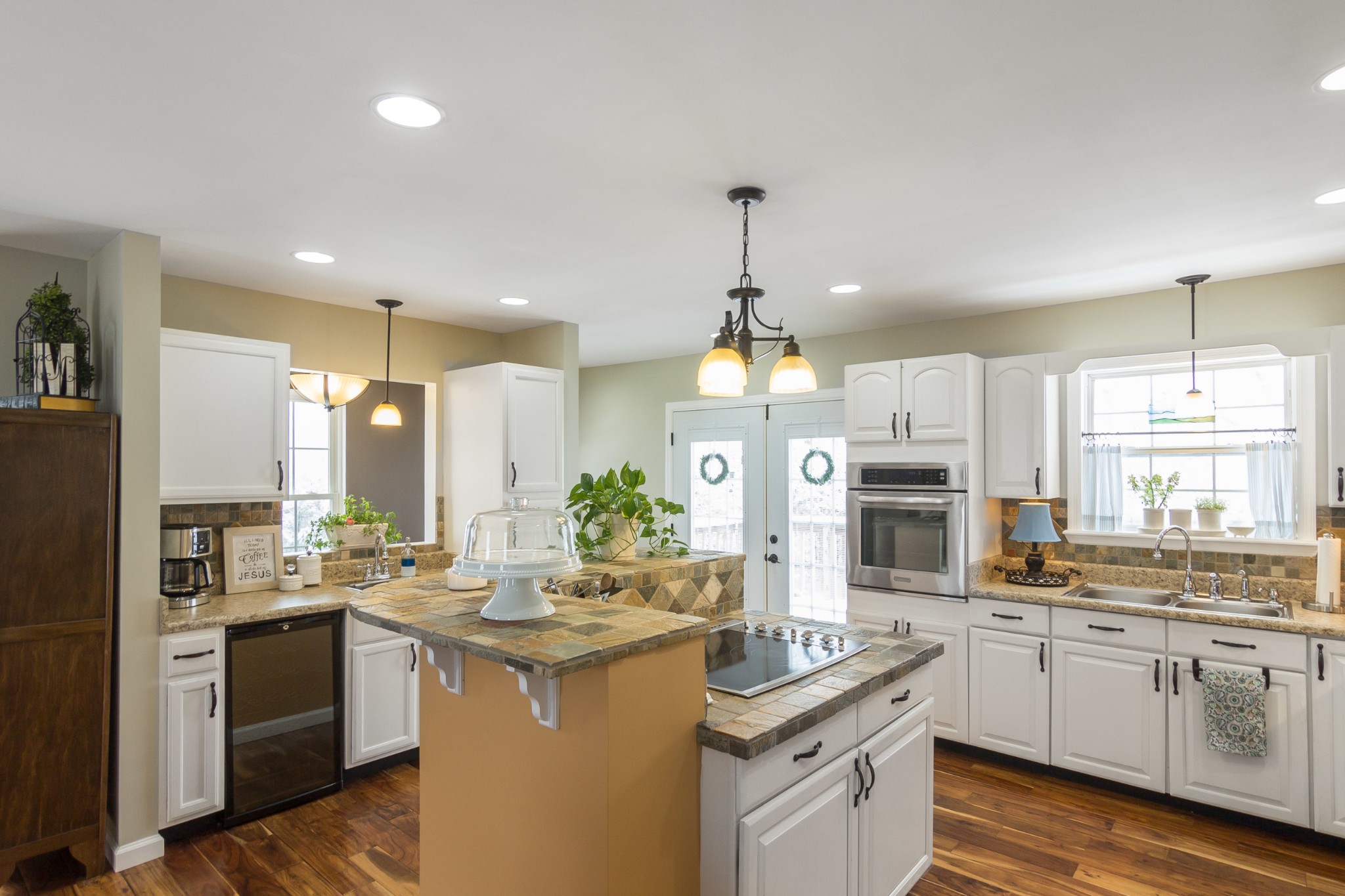 325 Osborne Road Watertown, TN 37184 - Photo 14 of 31 a kitchen with white cabinets and appliances