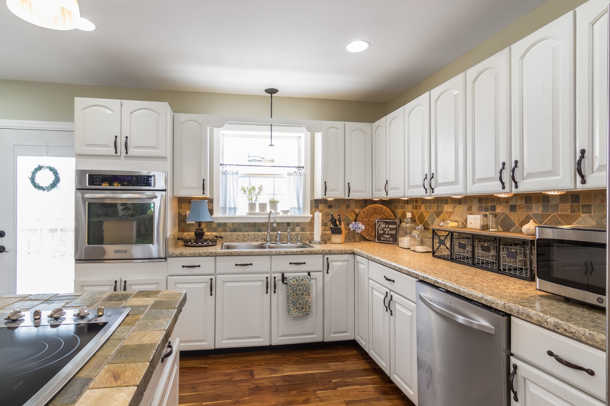 325 Osborne Road Watertown, TN 37184 - Photo 16 of 31 a kitchen with stainless steel appliances granite countertop a stove sink and cabinets