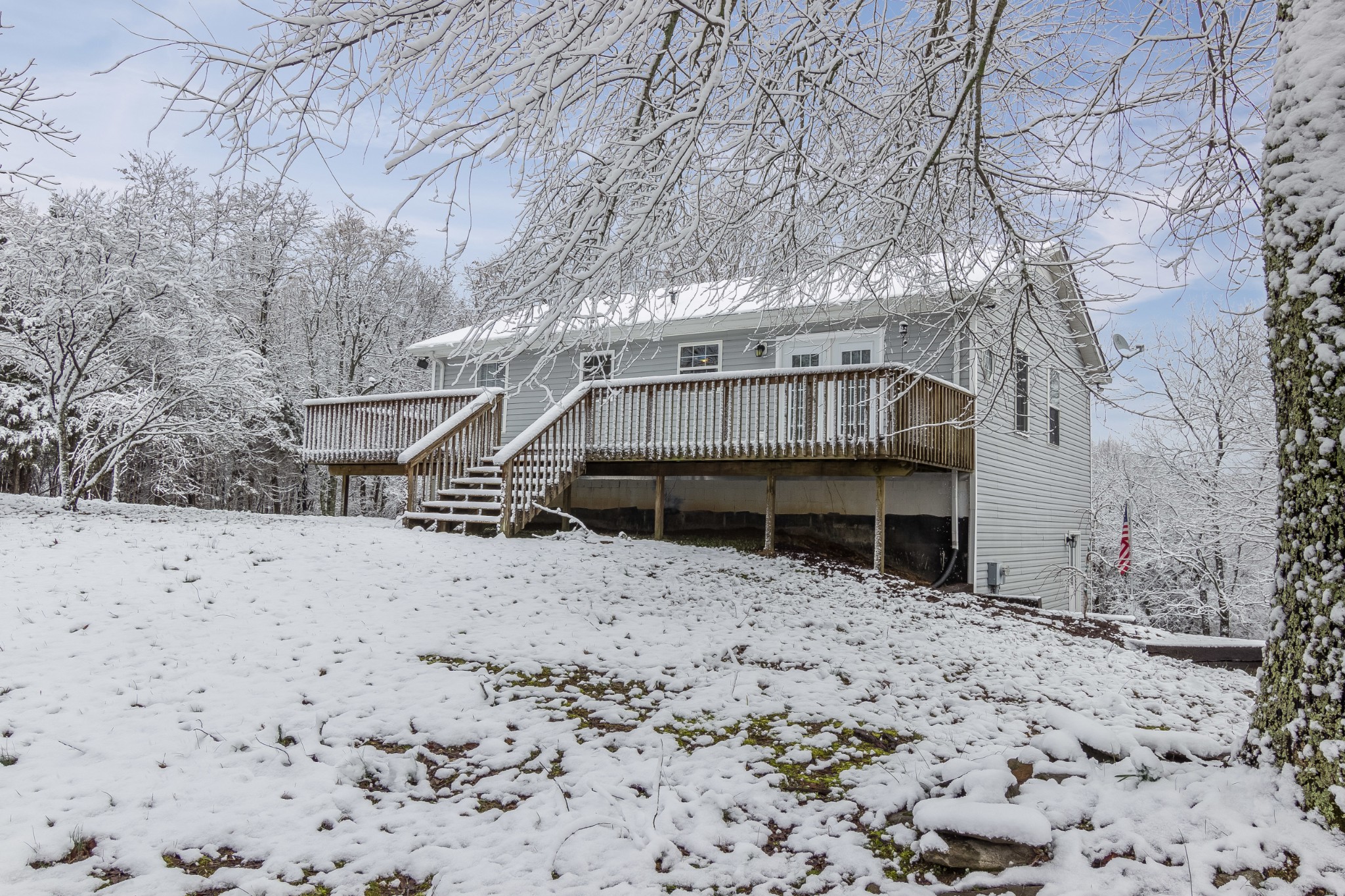 325 Osborne Road Watertown, TN 37184 - Photo 25 of 31 a view of a house with a yard covered in snow