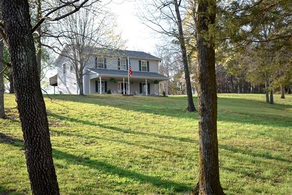 325 Osborne Road Watertown, TN 37184 - Photo 29 of 31 a view of a house with a big yard and large trees