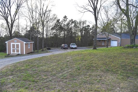 325 Osborne Road Watertown, TN 37184 - Photo 30 of 31 a front view of a house with garden