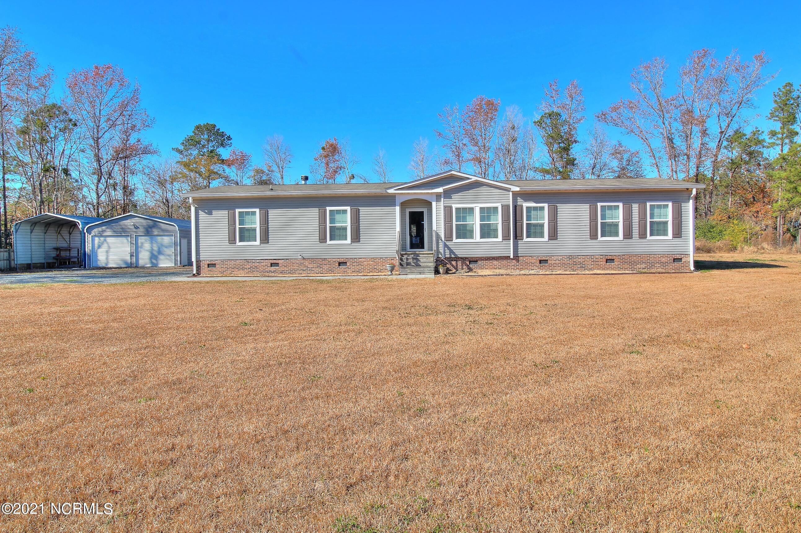 6965 Maple Road Northwest Ash, NC 28420 - Photo 1 of 21 Front 2
