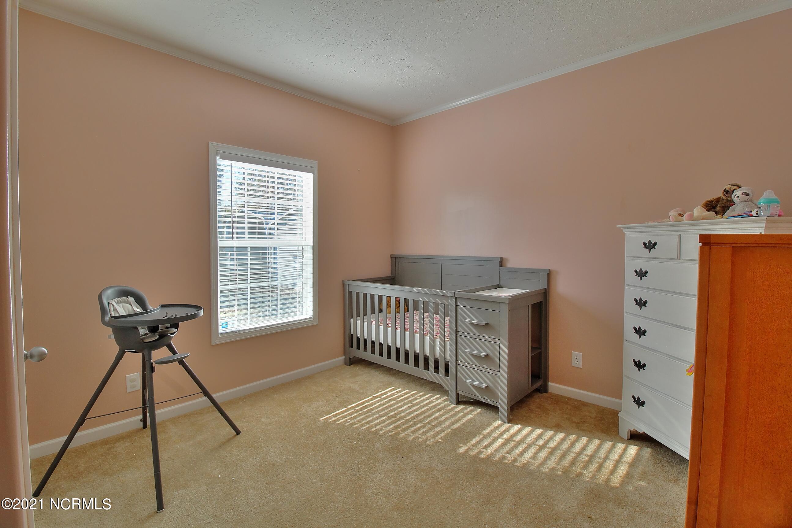 6965 Maple Road Northwest Ash, NC 28420 - Photo 15 of 21 Secondary Bedroom