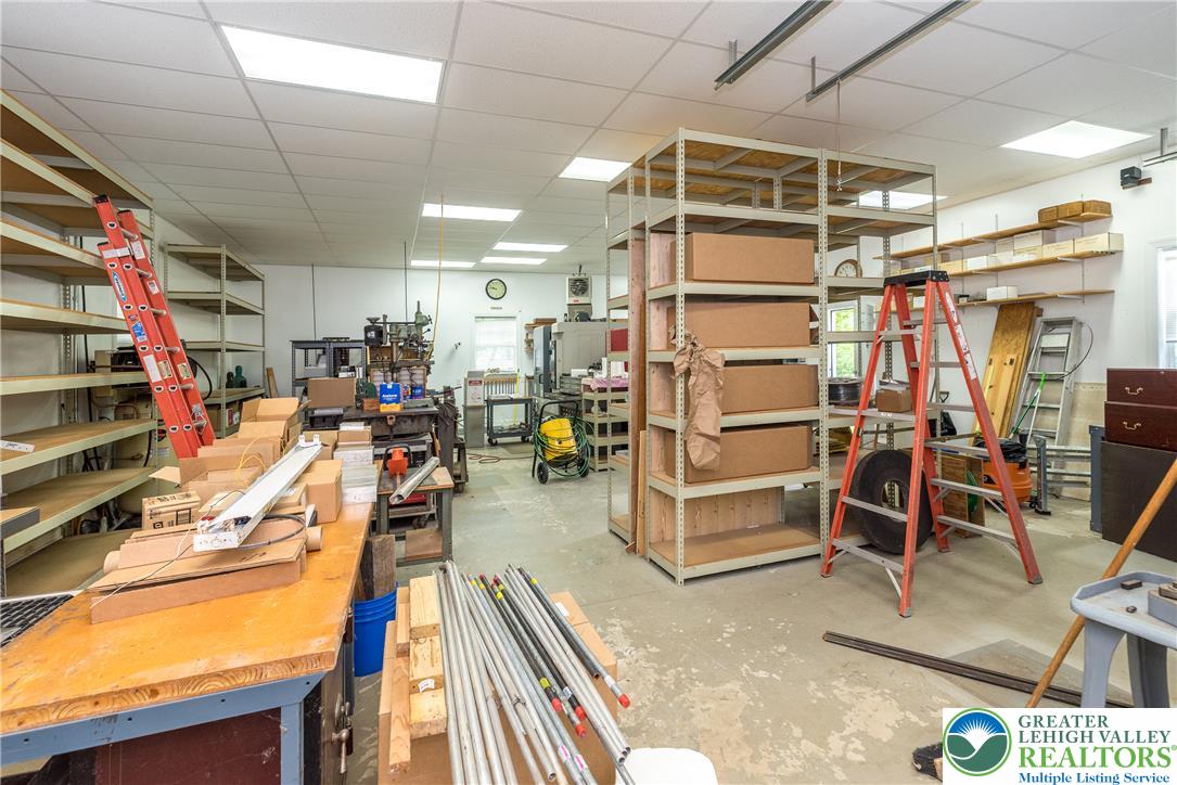 1815 Leithsville Road Hellertown, PA 18055 - Photo 27 of 38 A versatile space, this workshop provides ample storage and a concrete floor ready for diverse projects.