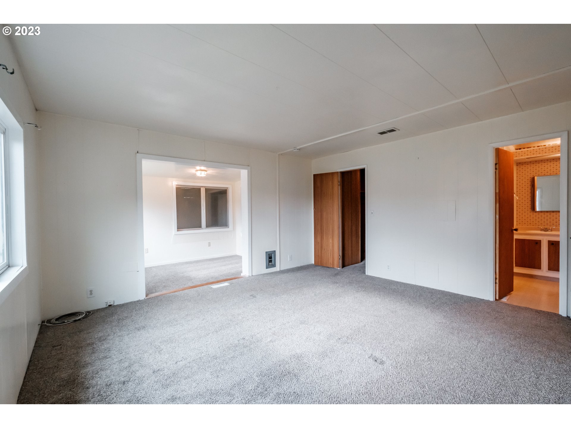 24333 Vaughn Road Veneta, OR 97487 - Photo 14 of 27 a view of an empty room with a window