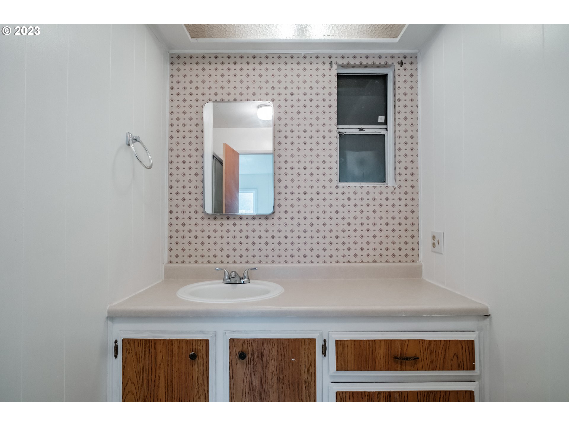 24333 Vaughn Road Veneta, OR 97487 - Photo 15 of 27 a bathroom with a sink a mirror and a vanity