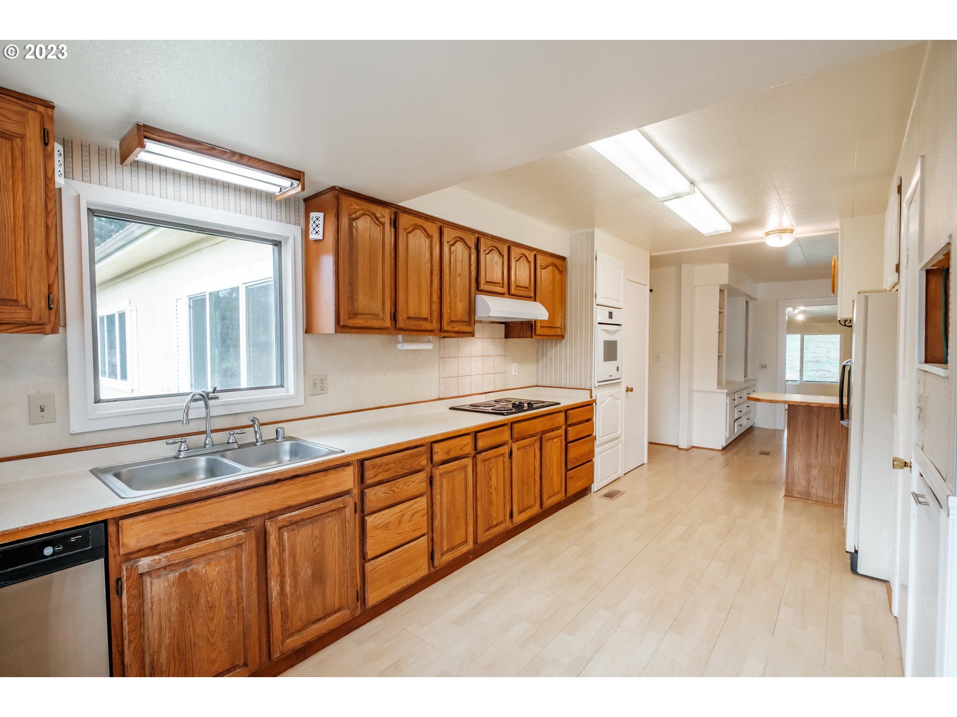 24333 Vaughn Road Veneta, OR 97487 - Photo 6 of 27 a large bathroom with a sink a mirror a bathtub and shower
