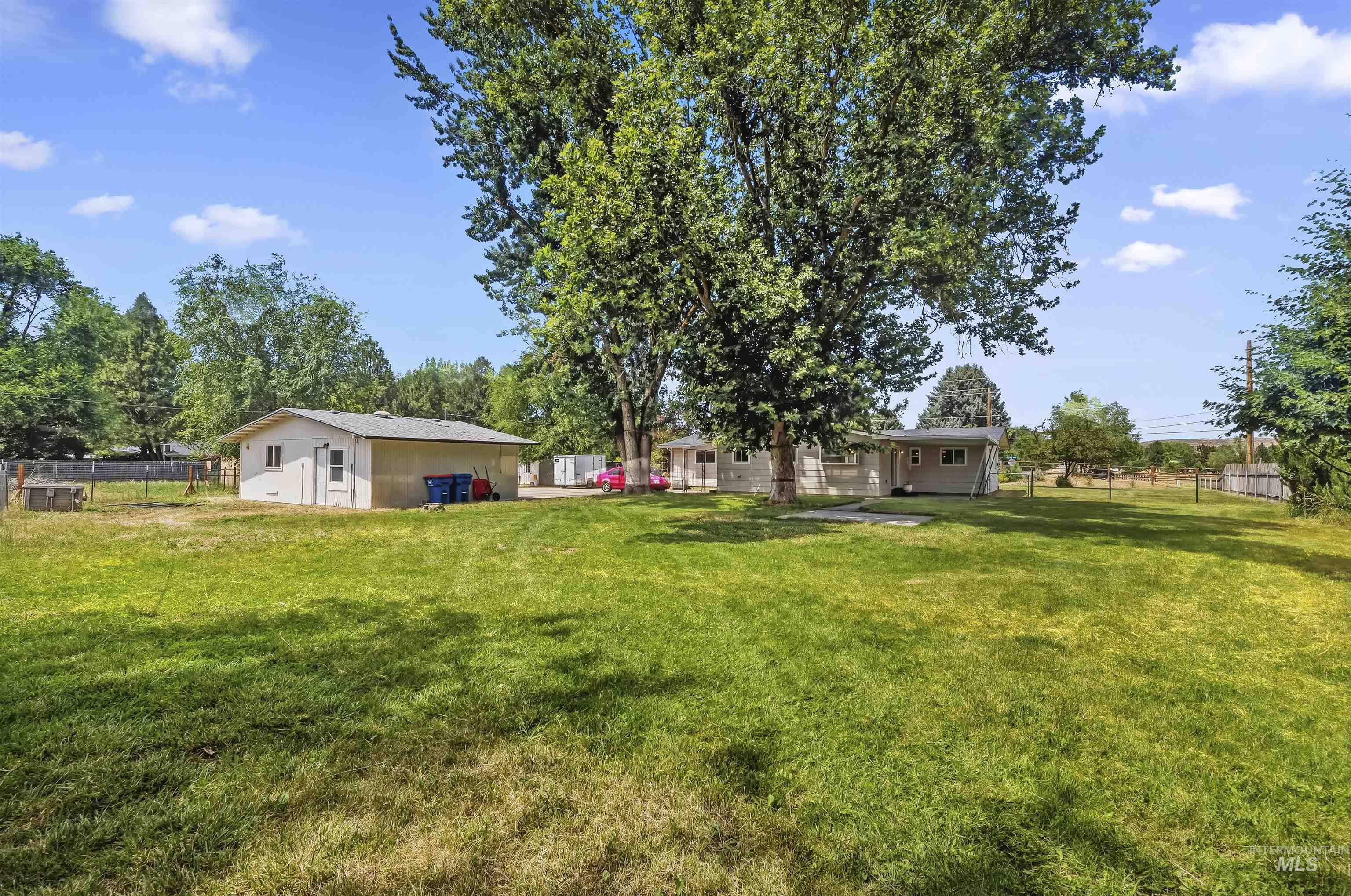 355 East Beacon Light Road Eagle, ID 83616 - Photo 36 of 47 Expansive grassy yard with mature trees providing ample shade