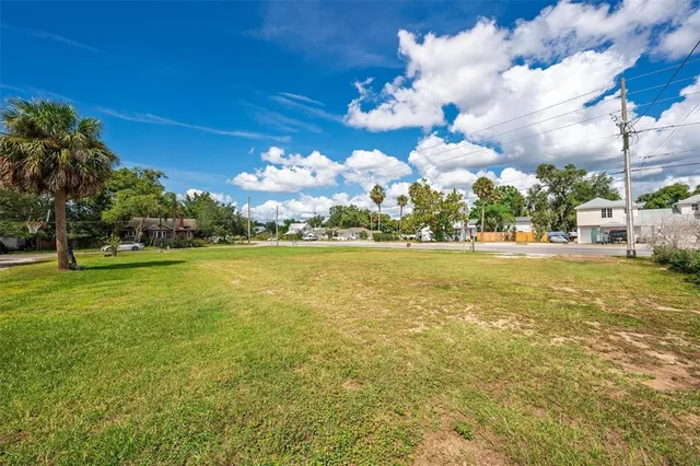 a view of a fountain with swimming pool in the back