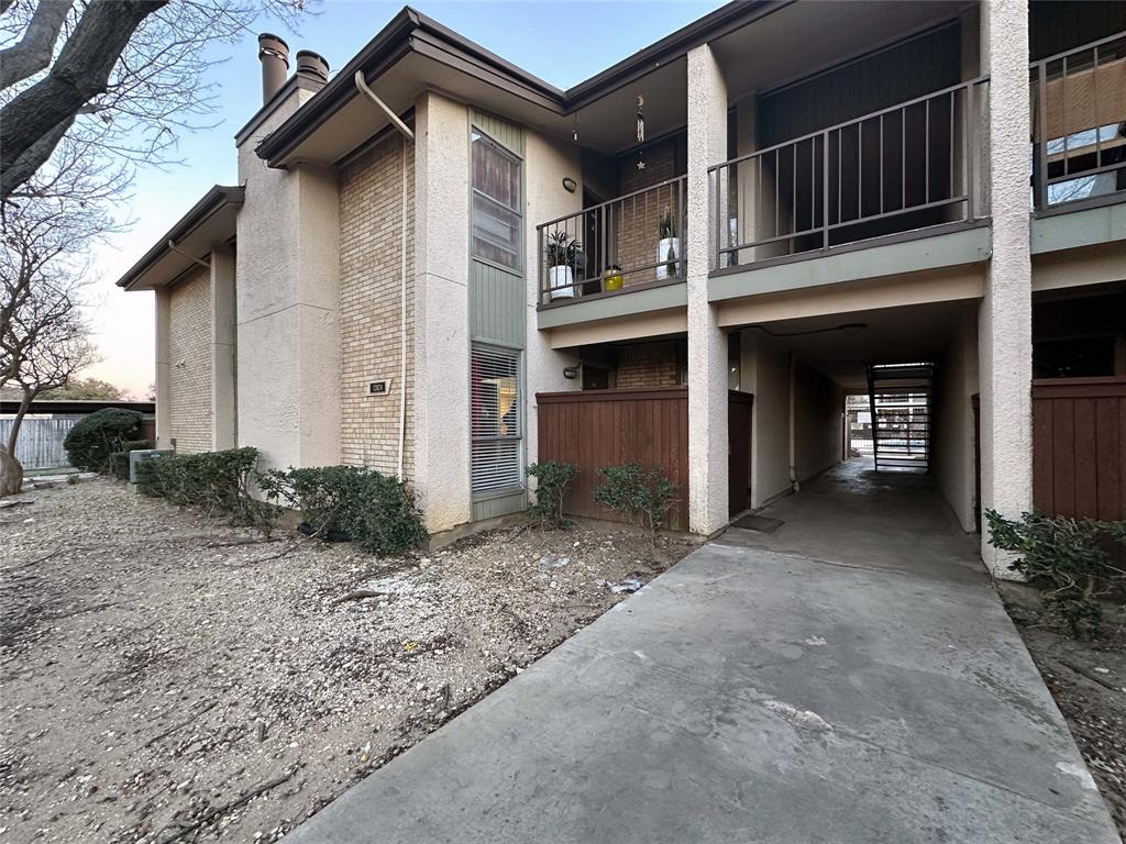 12824 Midway Road, Unit 1137 Dallas, TX 75244 - Photo 1 of 1 a front view of a house with garden