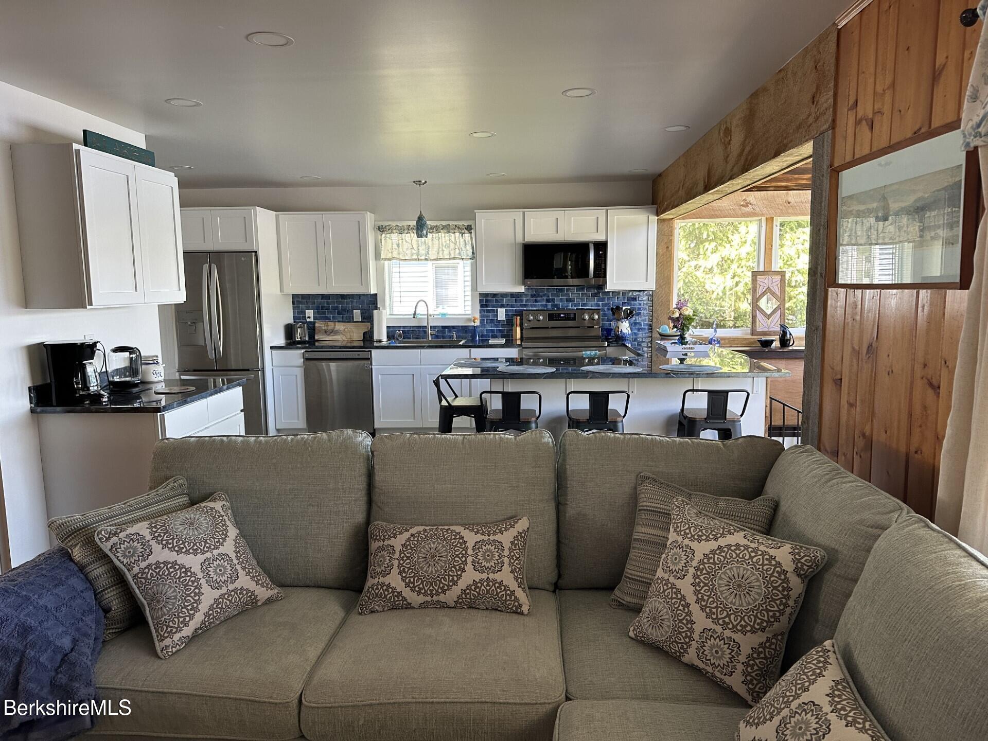 210 Shore Road Richmond, MA 01201 - Photo 13 of 22 a living room with furniture and a flat screen tv
