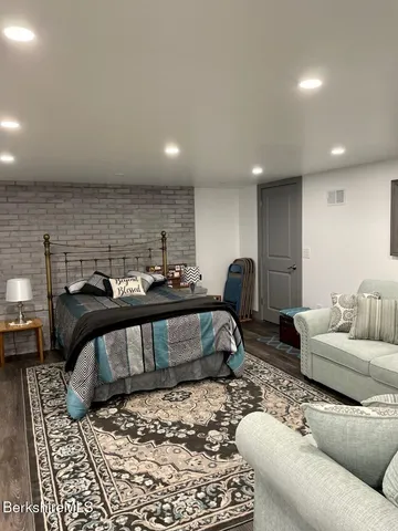 a bathroom with a toilet a sink and shower