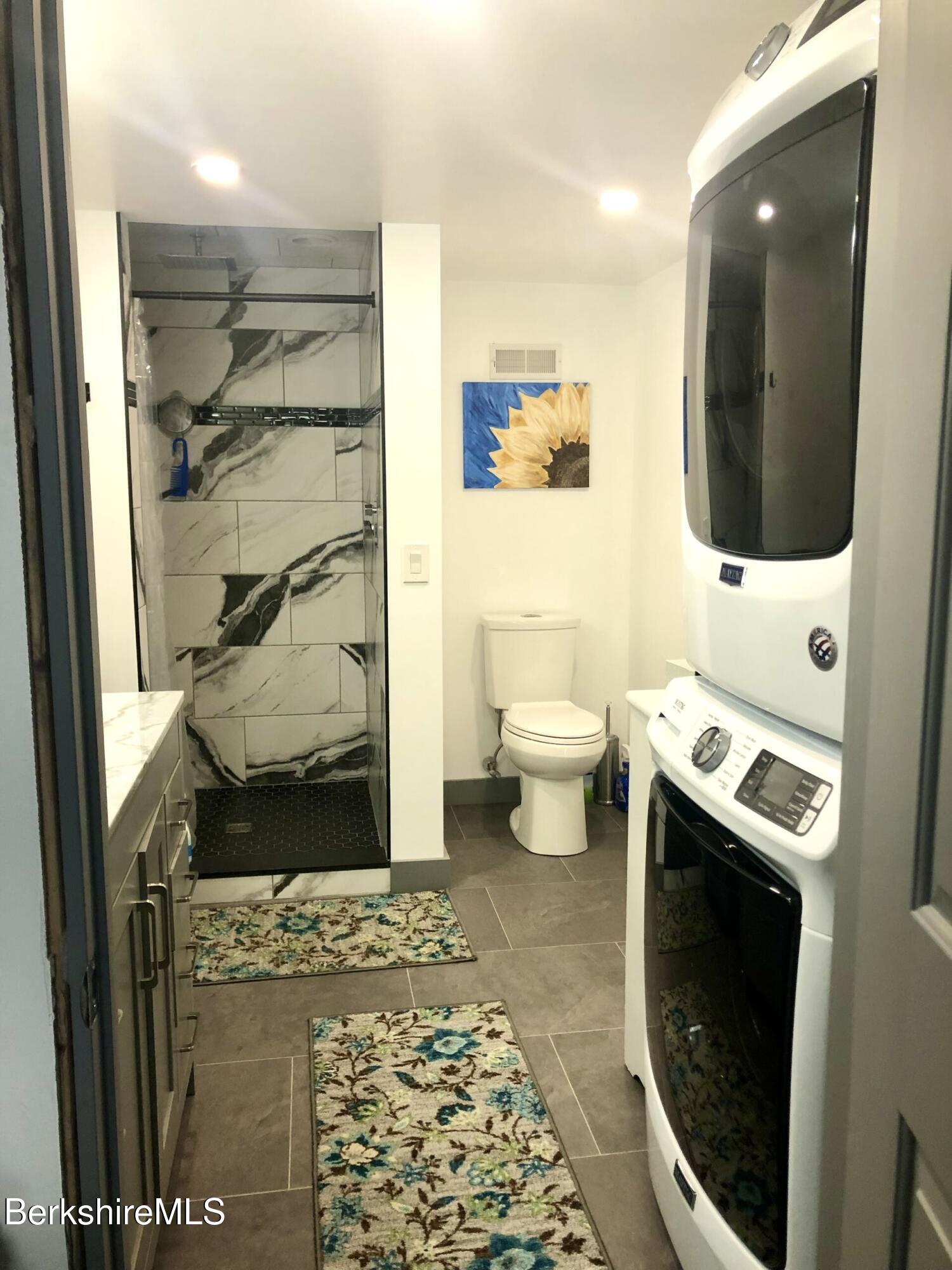 210 Shore Road Richmond, MA 01201 - Photo 20 of 22 a bathroom with a toilet a sink and shower