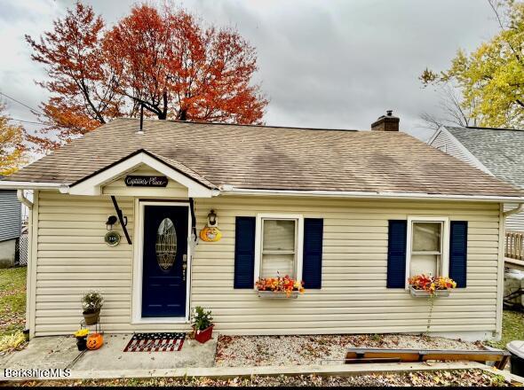 210 Shore Road Richmond, MA 01201 - Photo 2 of 22 a front view of a house with garden