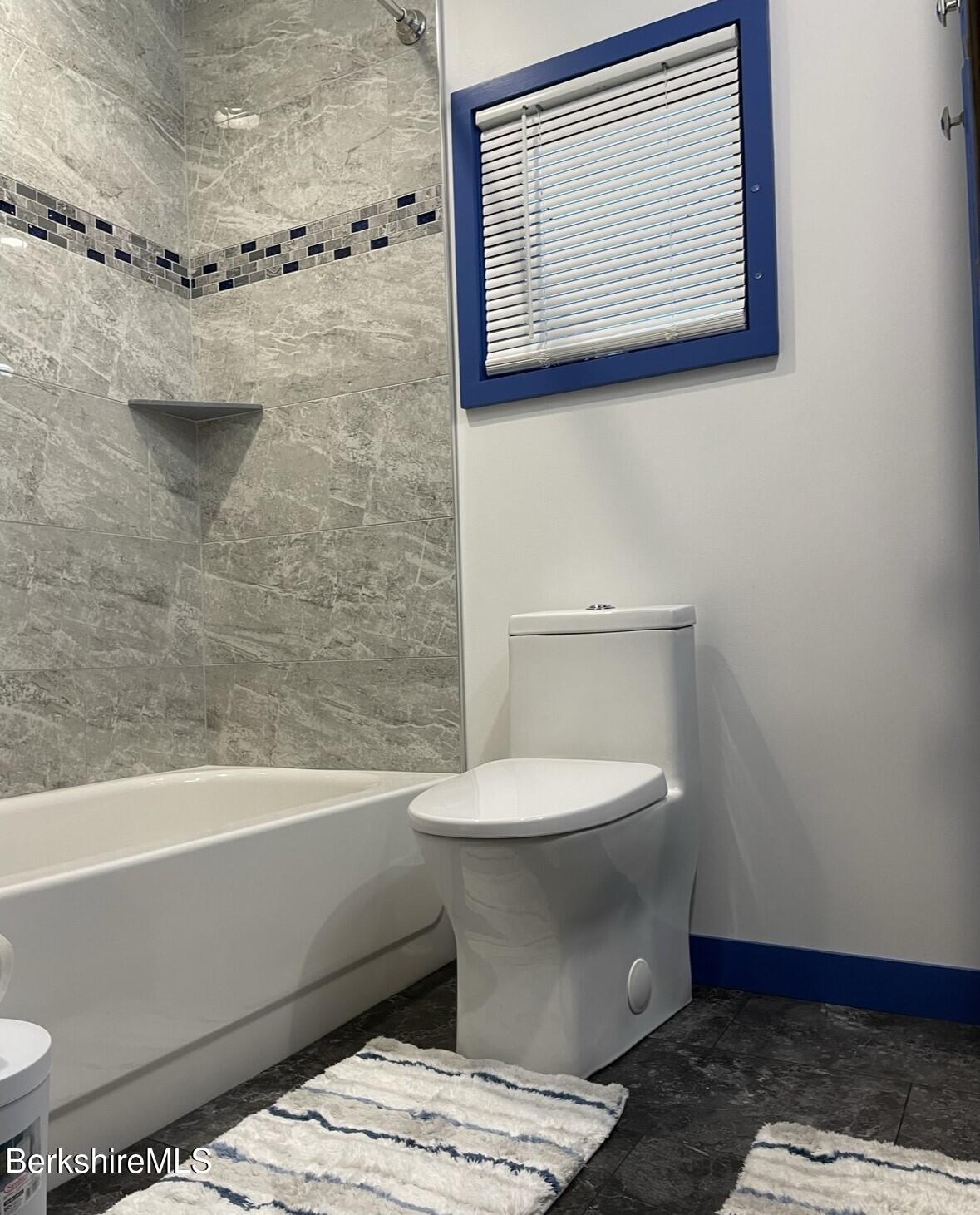 210 Shore Road Richmond, MA 01201 - Photo 8 of 22 a bathroom with a toilet and a bathtub