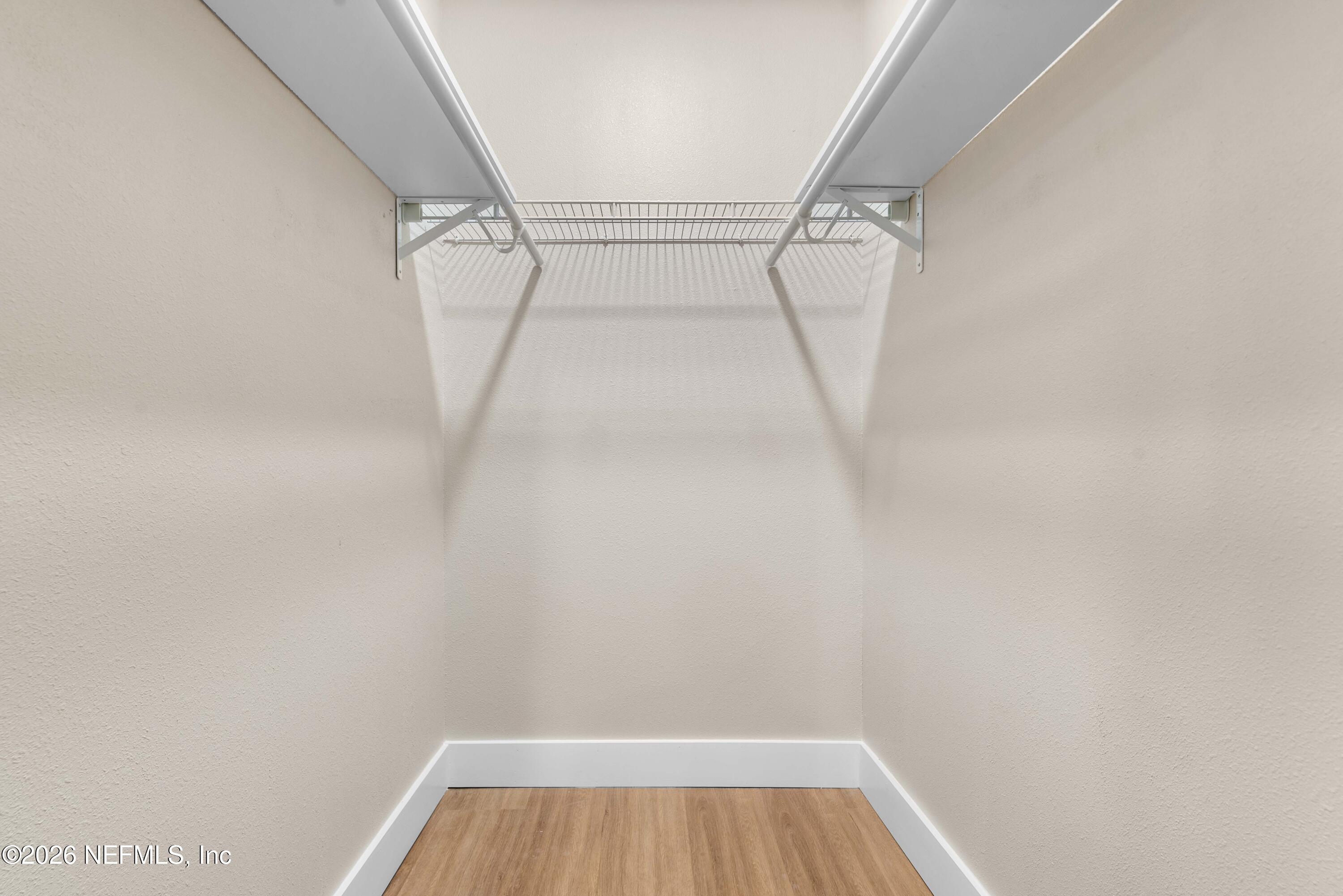 529 Sapelo Road Jacksonville, FL 32216 - Photo 20 of 31 a view of walk in closet with racks on the wall