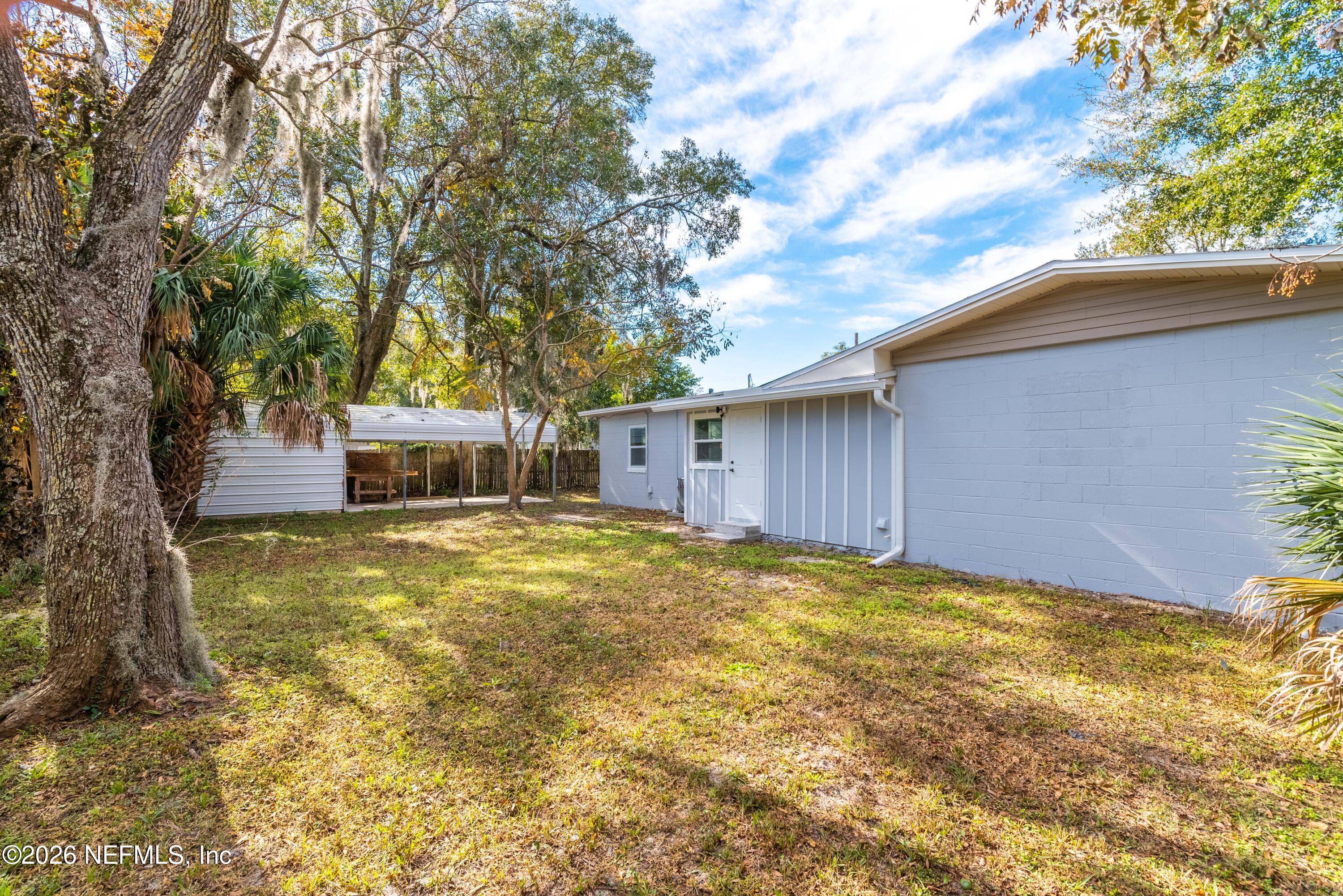 529 Sapelo Road Jacksonville, FL 32216 - Photo 28 of 31 a view of a house with backyard and tree