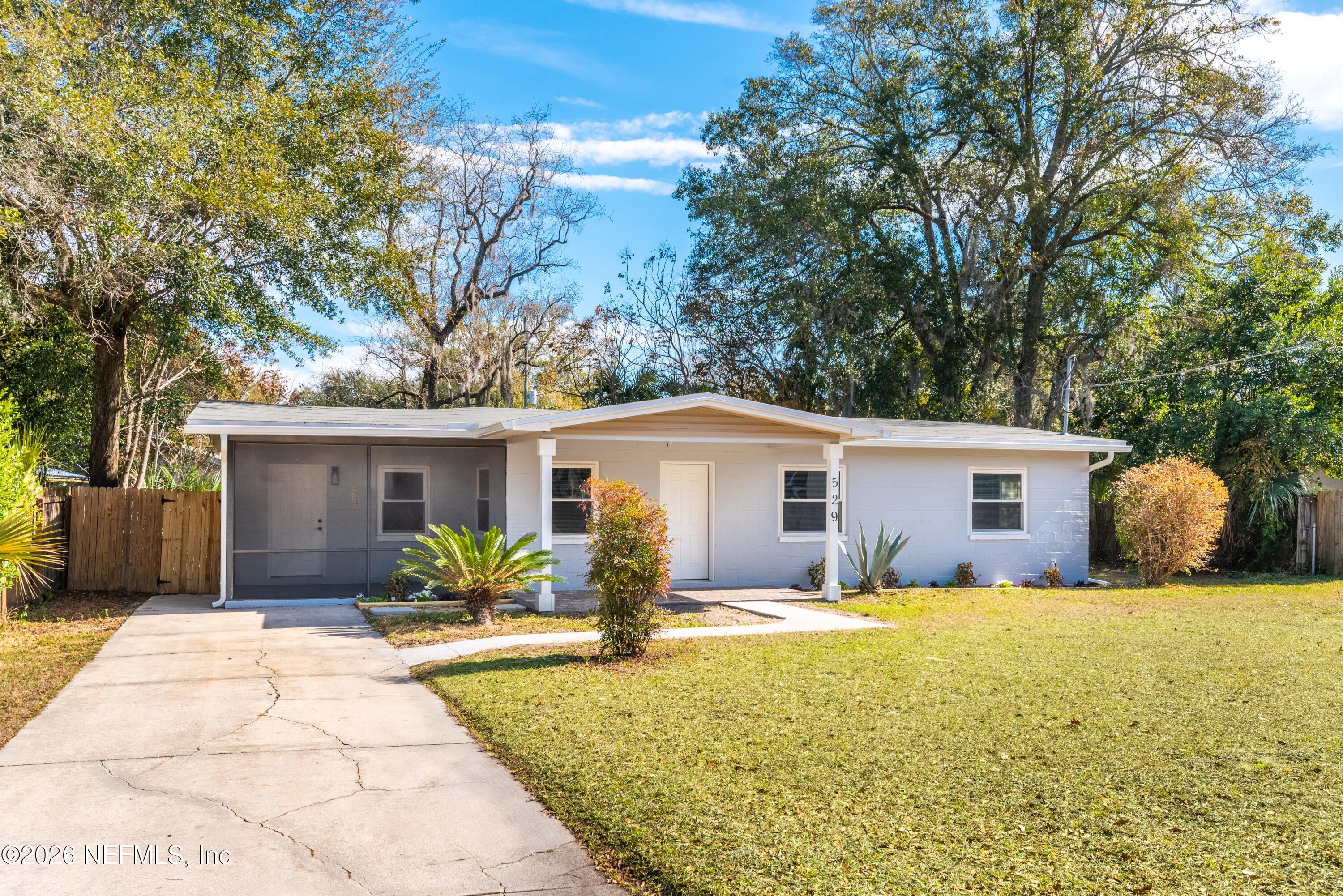 529 Sapelo Road Jacksonville, FL 32216 - Photo 3 of 31 a view of a house with outdoor space and tree s