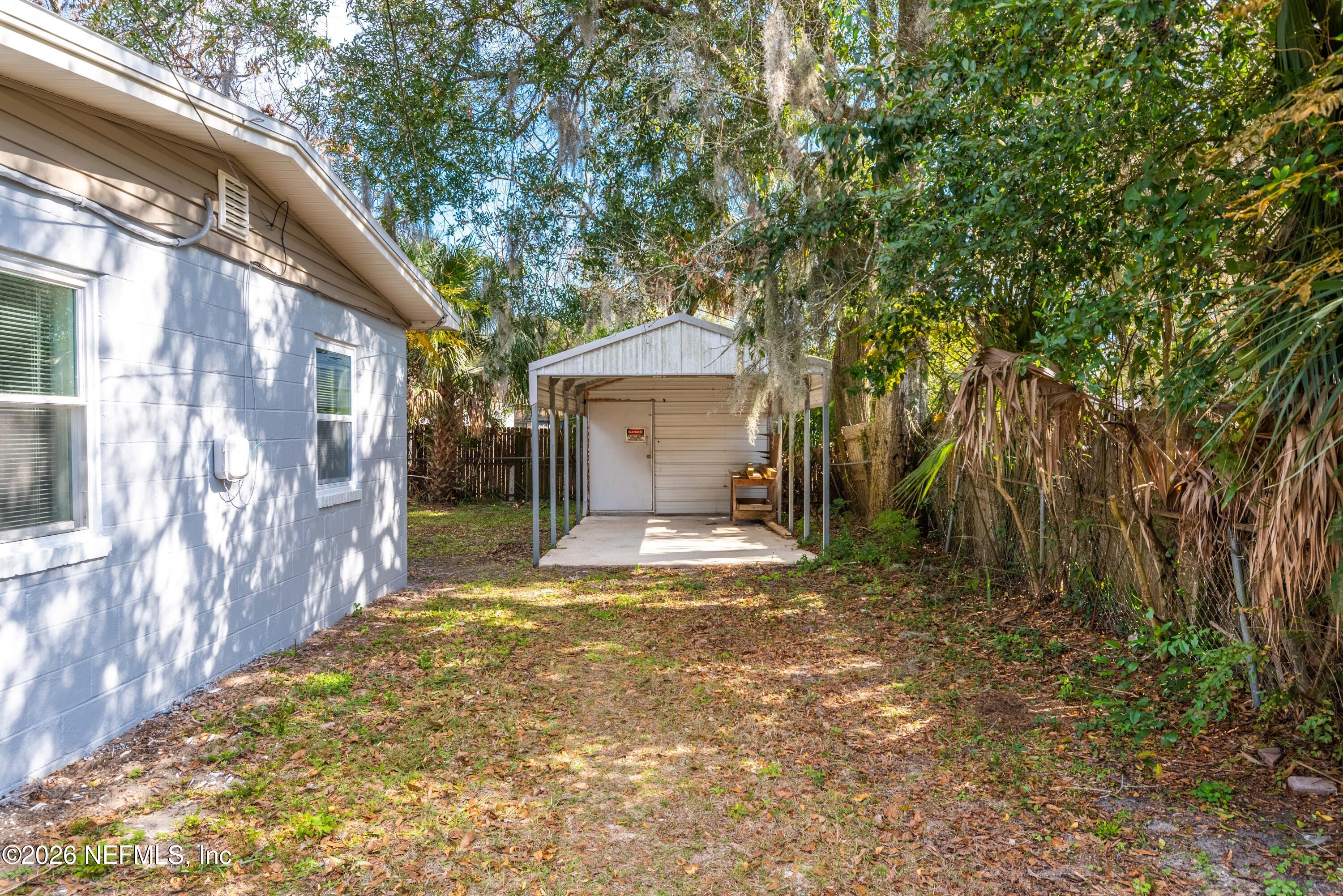 529 Sapelo Road Jacksonville, FL 32216 - Photo 31 of 31 a view of a house with a yard and garage