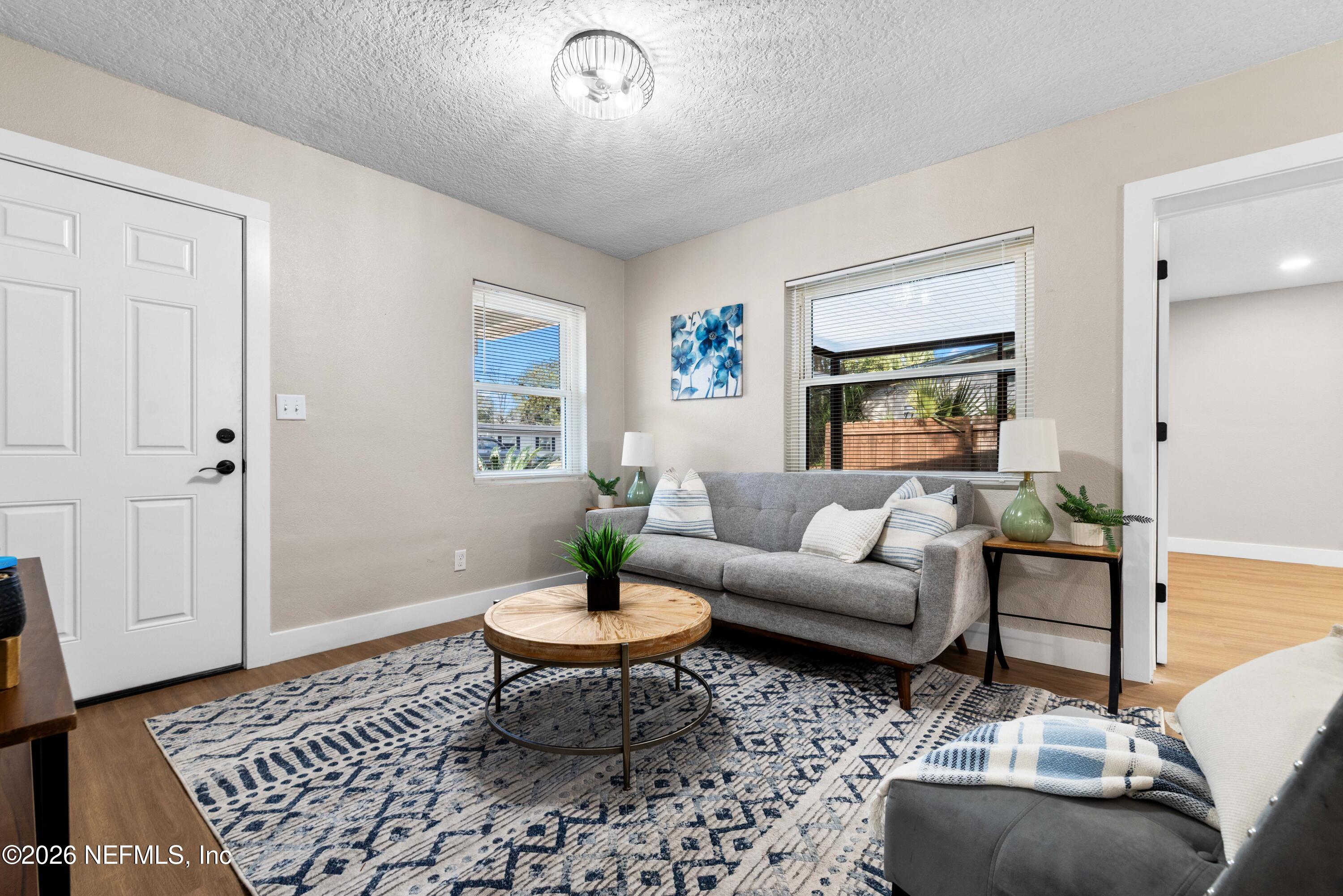 529 Sapelo Road Jacksonville, FL 32216 - Photo 8 of 31 a living room with furniture and a rug