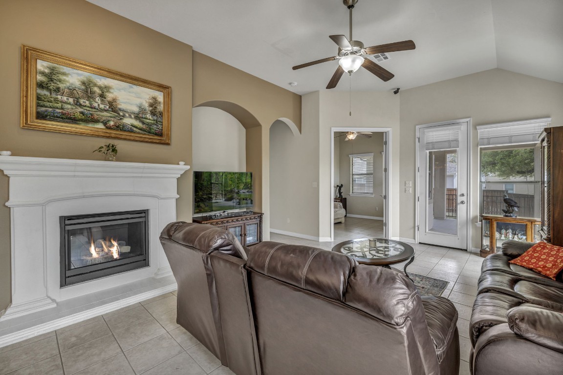 3821 Tordera Drive Austin, TX 78738 - Photo 13 of 30 a living room with furniture and a fireplace
