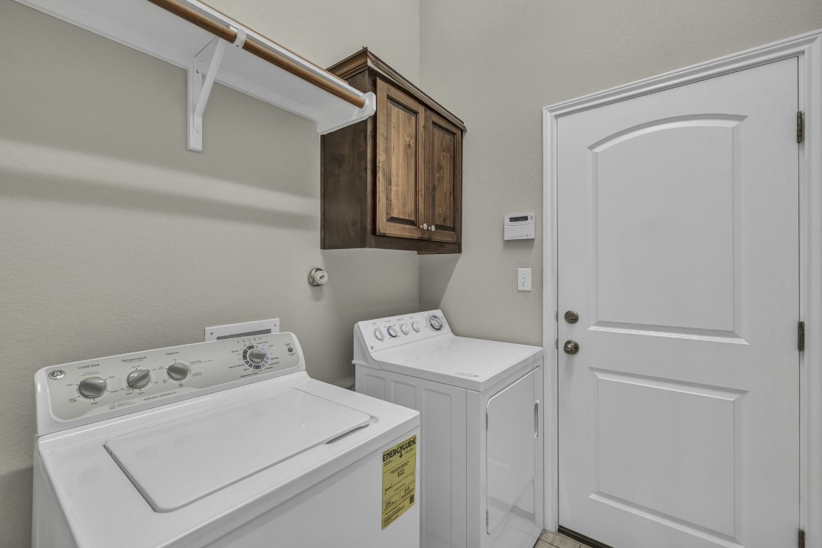 3821 Tordera Drive Austin, TX 78738 - Photo 18 of 30 a utility room with dryer and washer