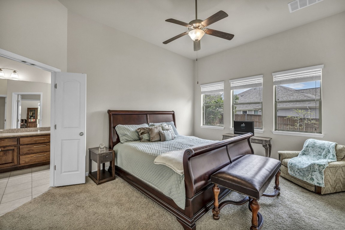 3821 Tordera Drive Austin, TX 78738 - Photo 22 of 30 a bedroom with a bed and a couch