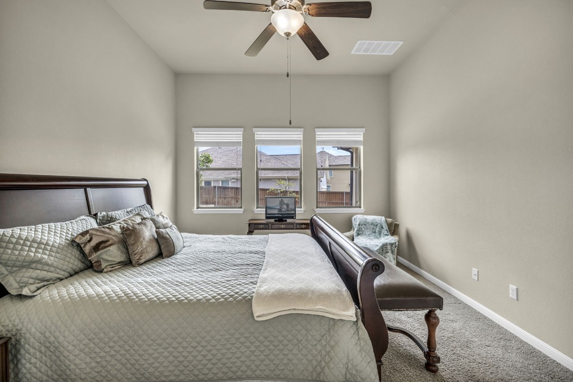 3821 Tordera Drive Austin, TX 78738 - Photo 24 of 30 a bedroom with a bed and a window