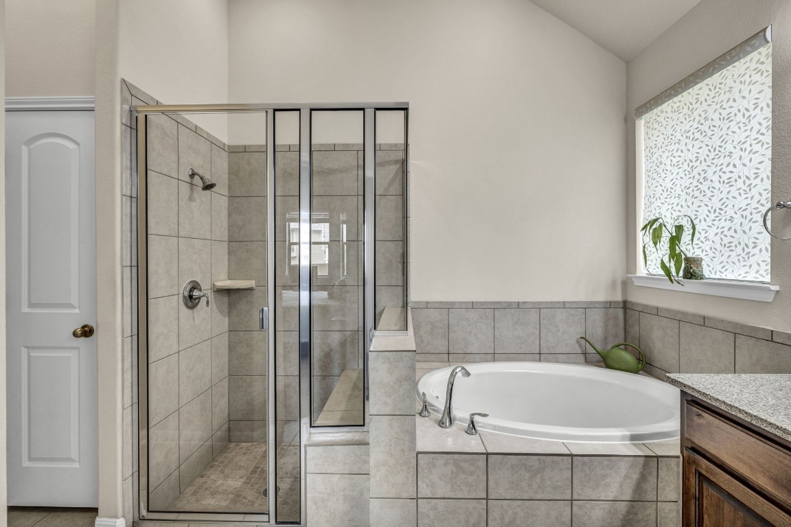 3821 Tordera Drive Austin, TX 78738 - Photo 26 of 30 a bathroom with a bathtub and shower