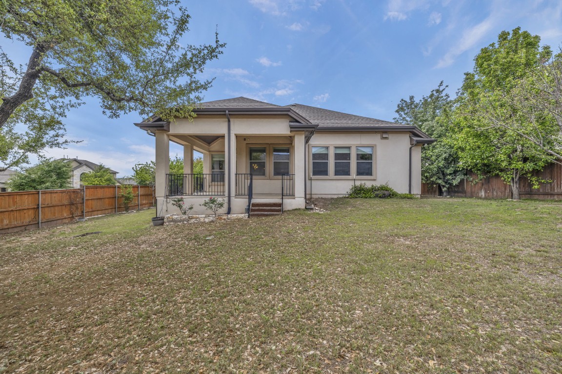3821 Tordera Drive Austin, TX 78738 - Photo 29 of 30 front view of a house with a big yard