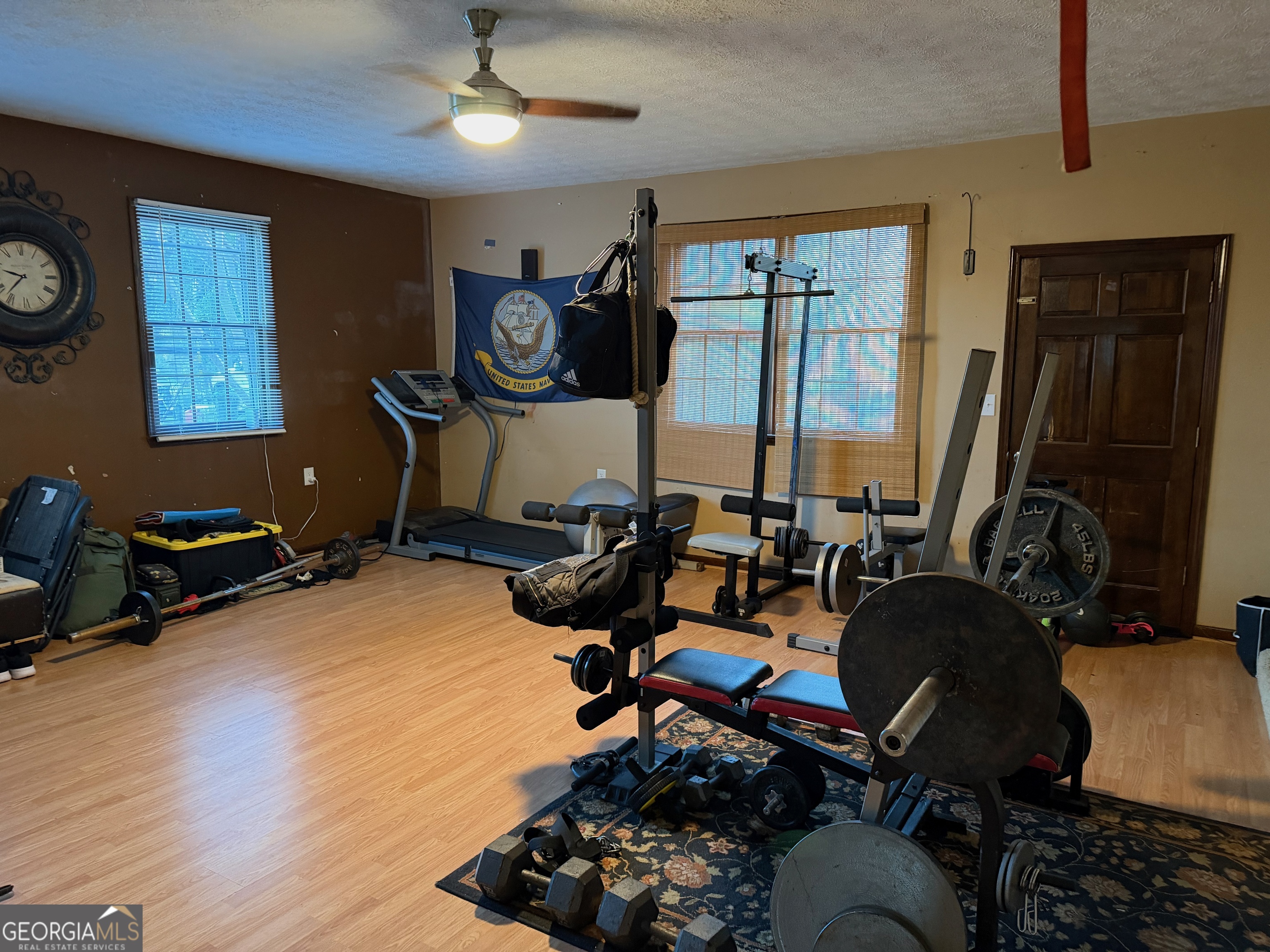 710 Armstrong Mill Road Franklin, GA 30217 - Photo 14 of 19 a room with gym equipment and a large window