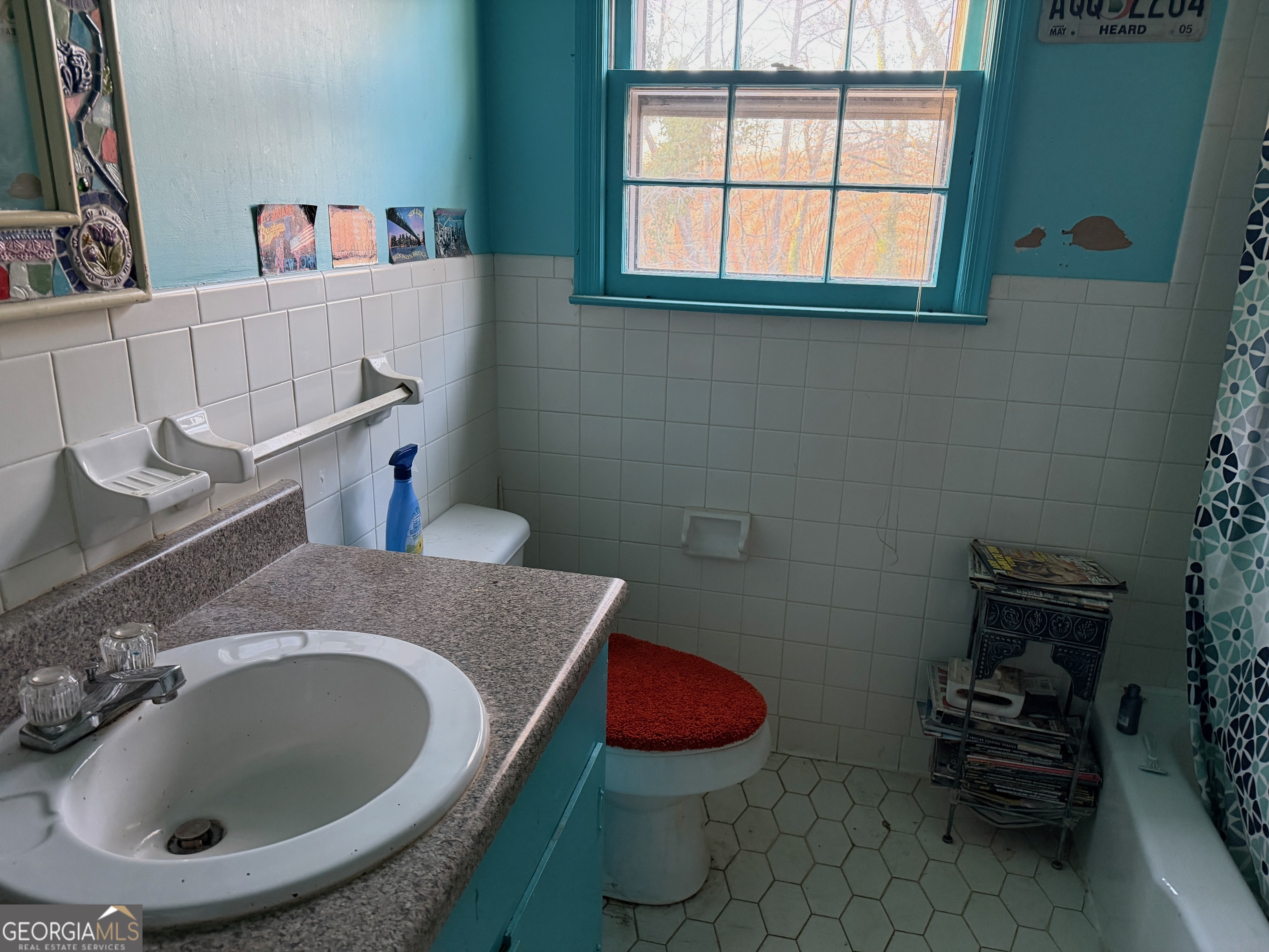 710 Armstrong Mill Road Franklin, GA 30217 - Photo 15 of 19 a bathroom with a granite countertop sink and a mirror
