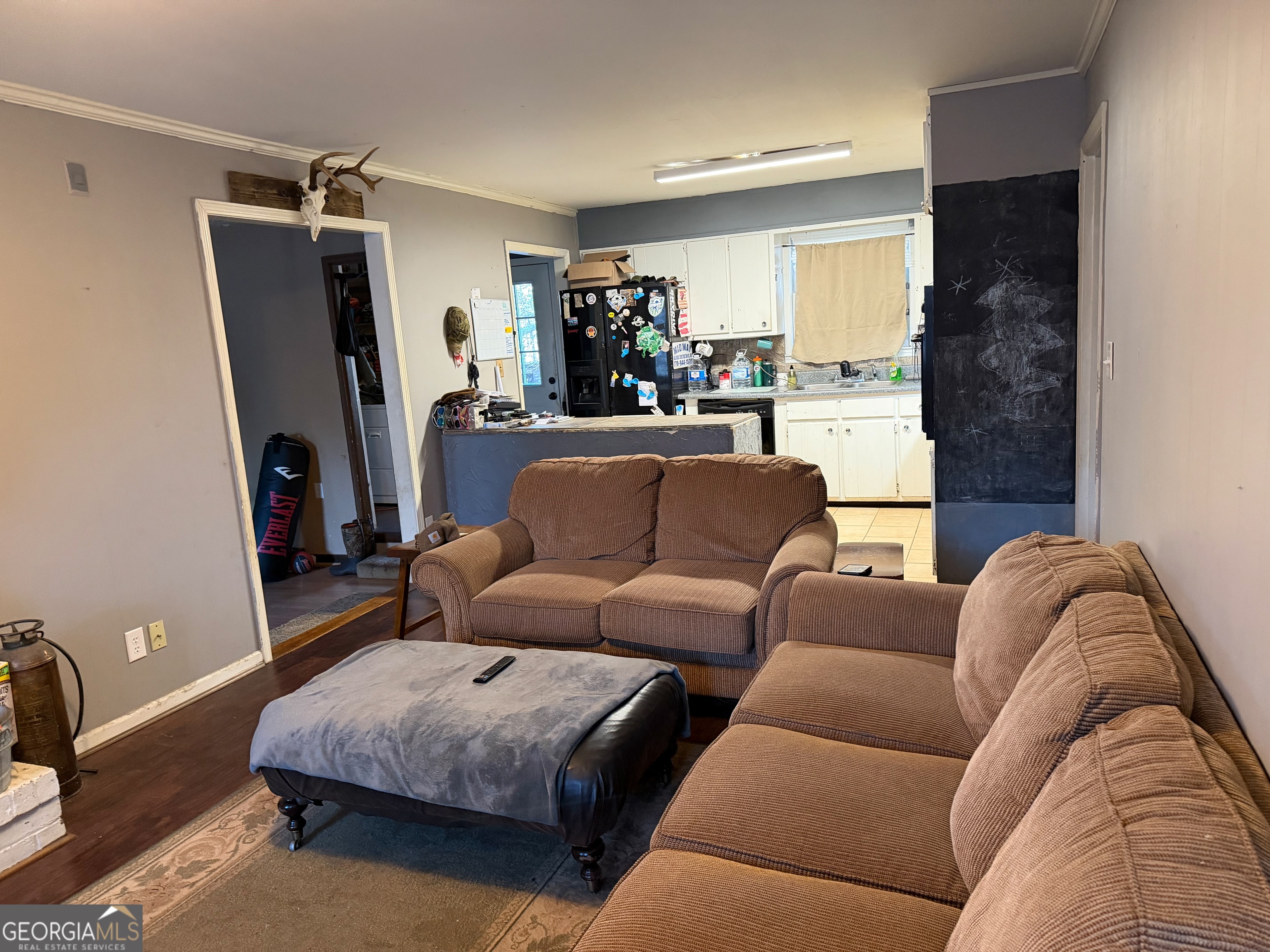 710 Armstrong Mill Road Franklin, GA 30217 - Photo 5 of 19 a living room with furniture and a flat screen tv