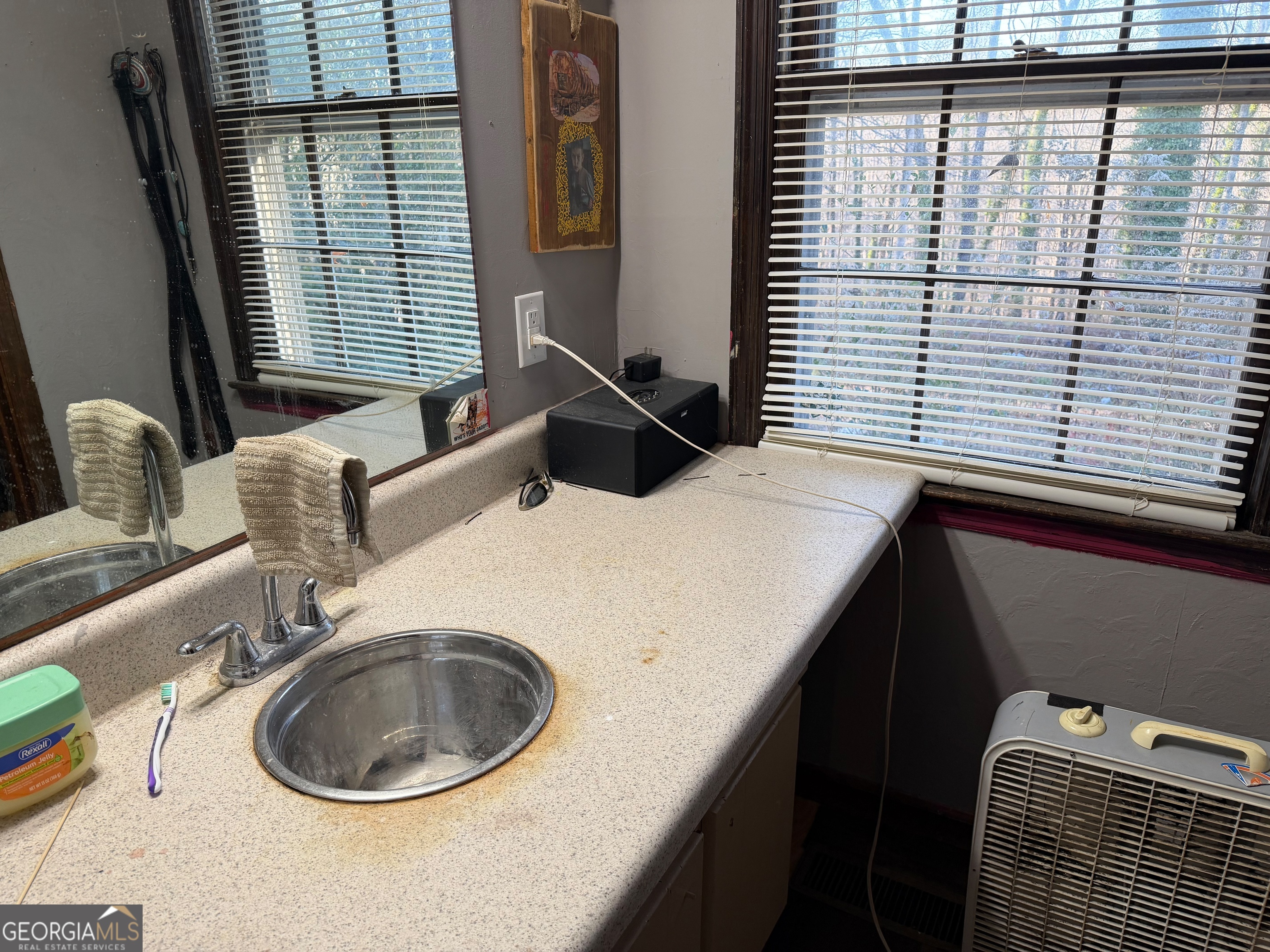 710 Armstrong Mill Road Franklin, GA 30217 - Photo 7 of 19 a kitchen with a sink and a window