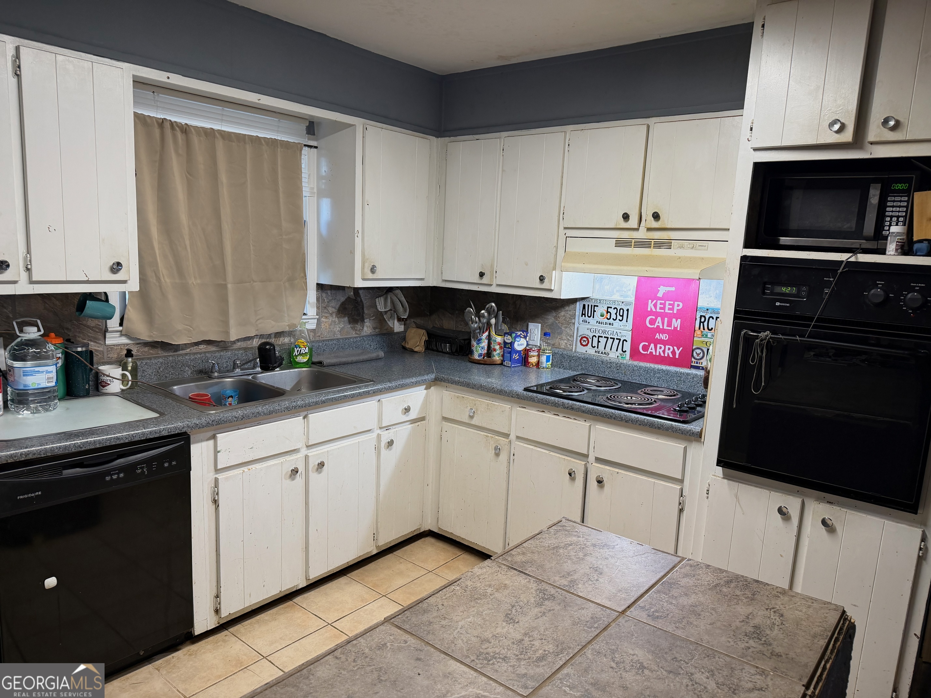 710 Armstrong Mill Road Franklin, GA 30217 - Photo 8 of 19 a kitchen with granite countertop a stove sink and cabinets