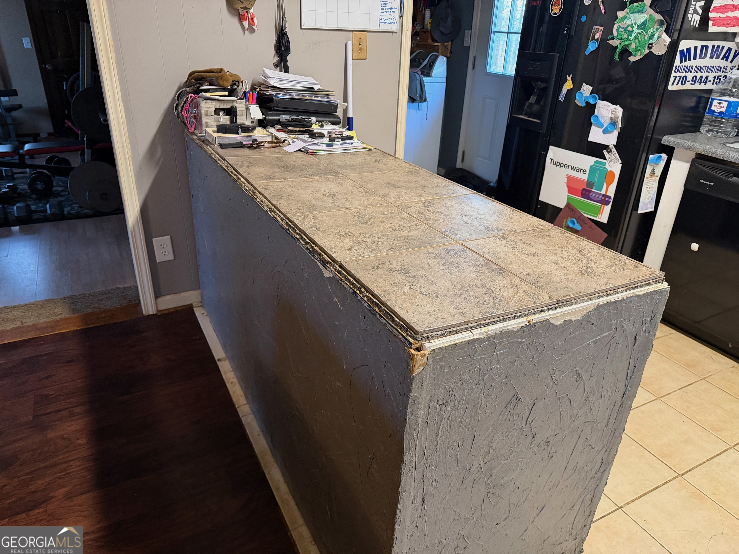 710 Armstrong Mill Road Franklin, GA 30217 - Photo 9 of 19 a room with water heater and wooden floor