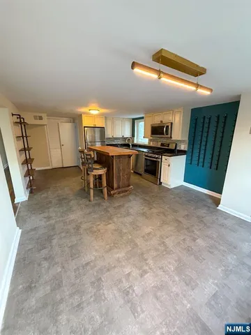 a bed room with a bed and a television