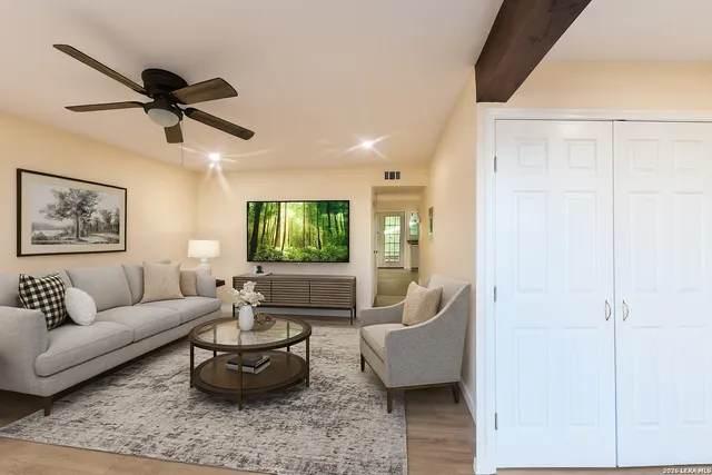 a living room with furniture and a large window