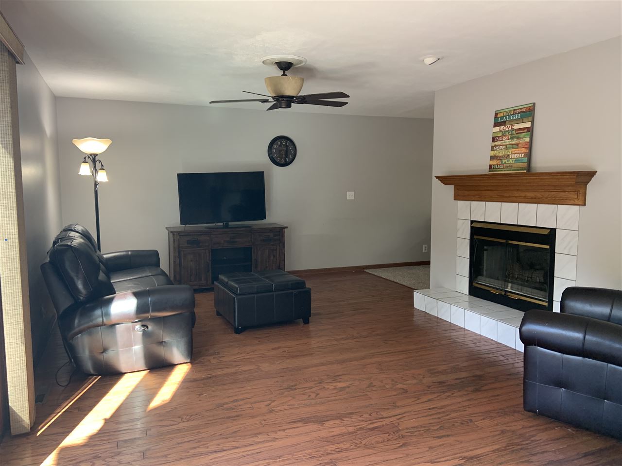6912 Sentinel Road Rockford, IL 61107 - Photo 16 of 27 a living room with furniture and a fireplace