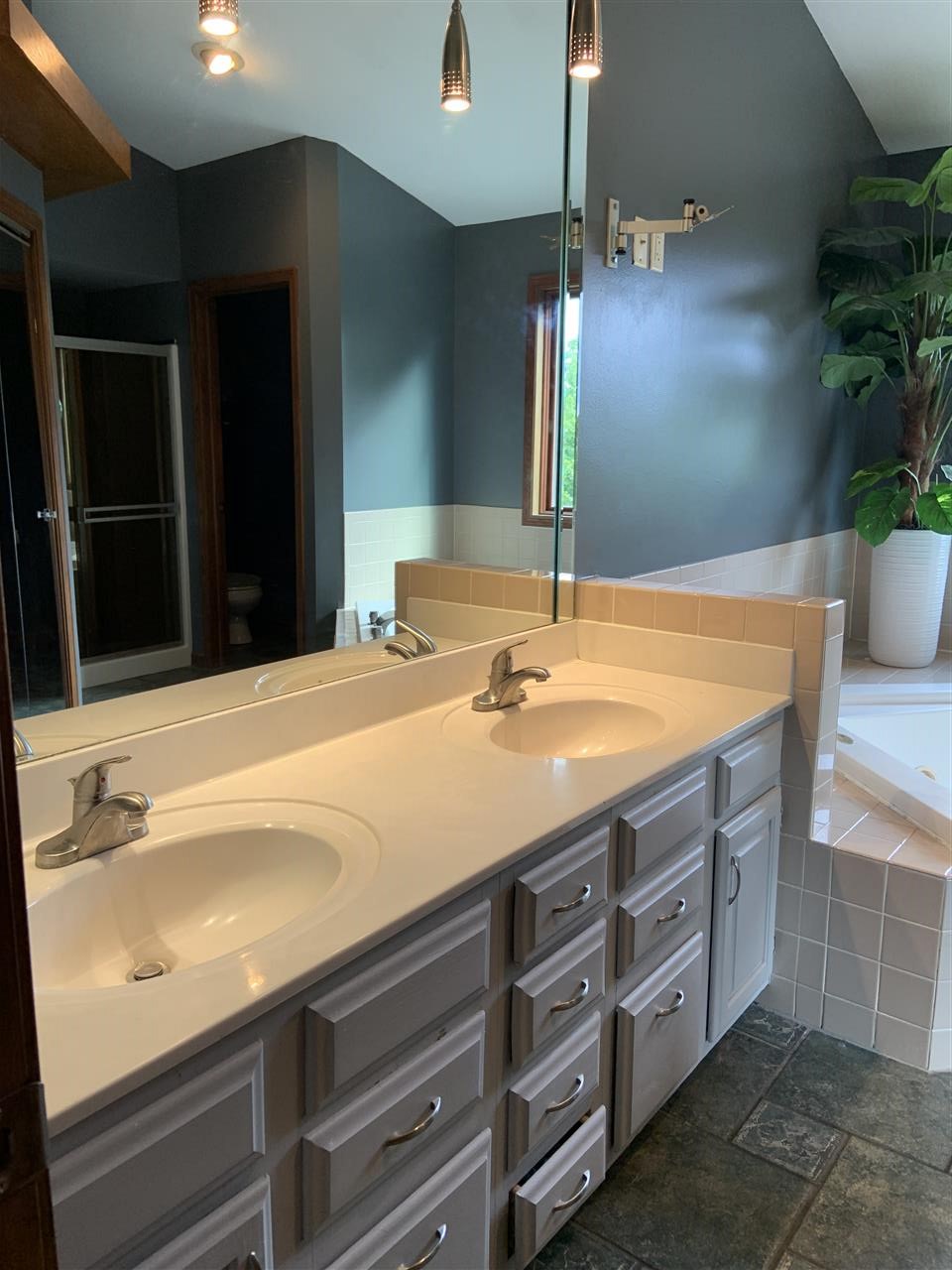 6912 Sentinel Road Rockford, IL 61107 - Photo 21 of 27 a bathroom with a sink and a mirror