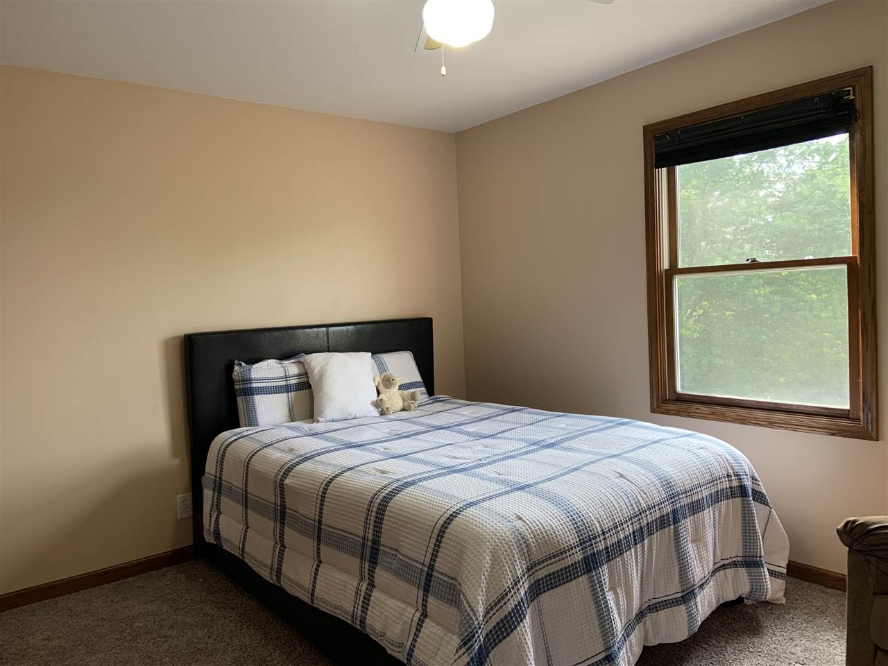 6912 Sentinel Road Rockford, IL 61107 - Photo 25 of 27 a bedroom with a bed and a window
