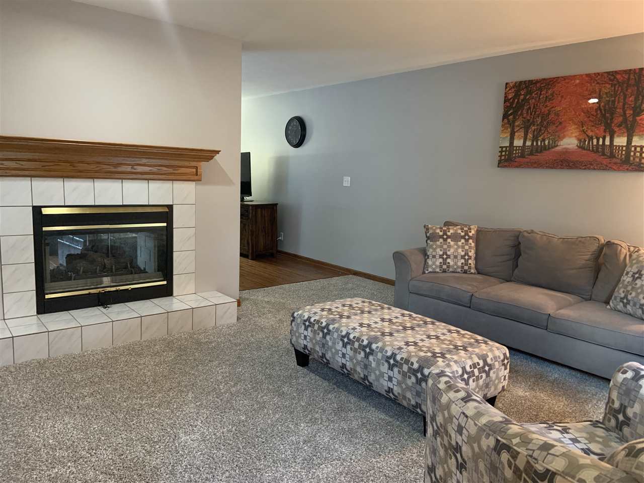 6912 Sentinel Road Rockford, IL 61107 - Photo 6 of 27 a living room with furniture and a fireplace