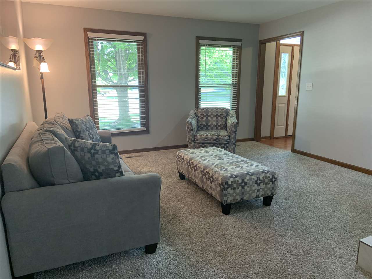 6912 Sentinel Road Rockford, IL 61107 - Photo 7 of 27 a living room with furniture and a window