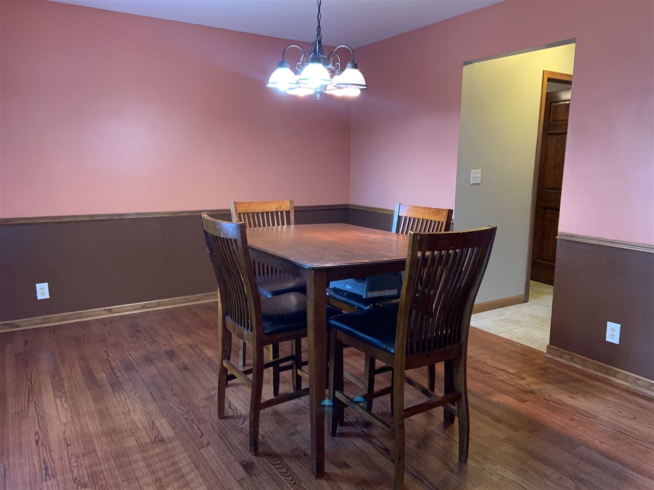 6912 Sentinel Road Rockford, IL 61107 - Photo 8 of 27 a view of a dining room with furniture and wooden floor