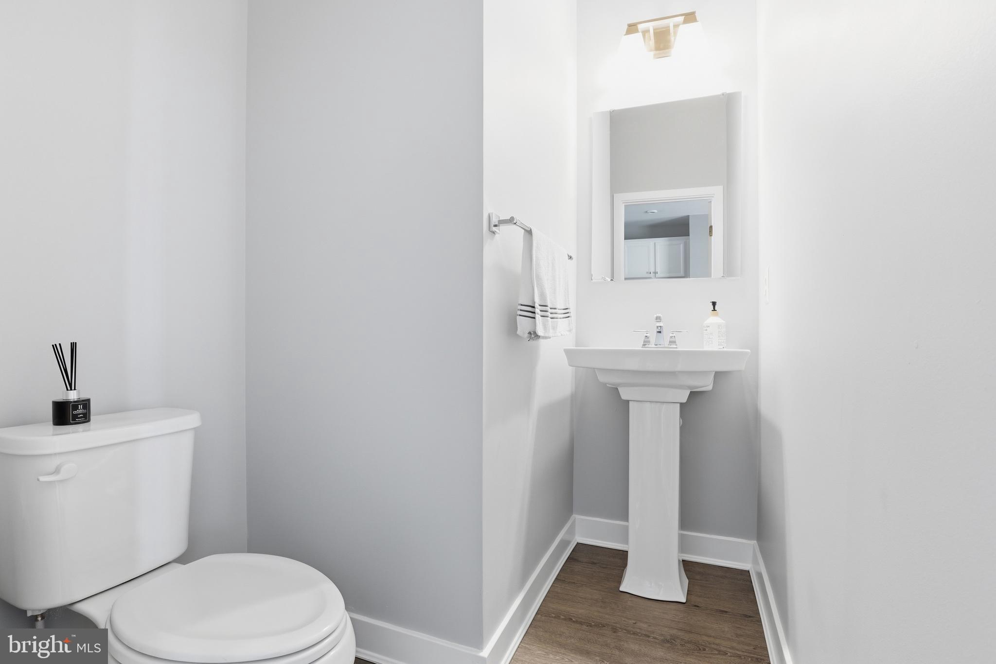 550 Lewes Landing Road Middletown, DE 19709 - Photo 12 of 38 a bathroom with a sink a toilet and mirror