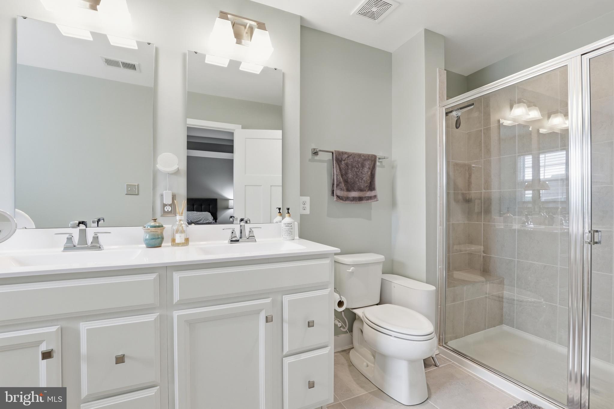 550 Lewes Landing Road Middletown, DE 19709 - Photo 19 of 38 a bathroom with a sink toilet vanity and shower