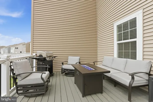 a view of a roof deck with patio