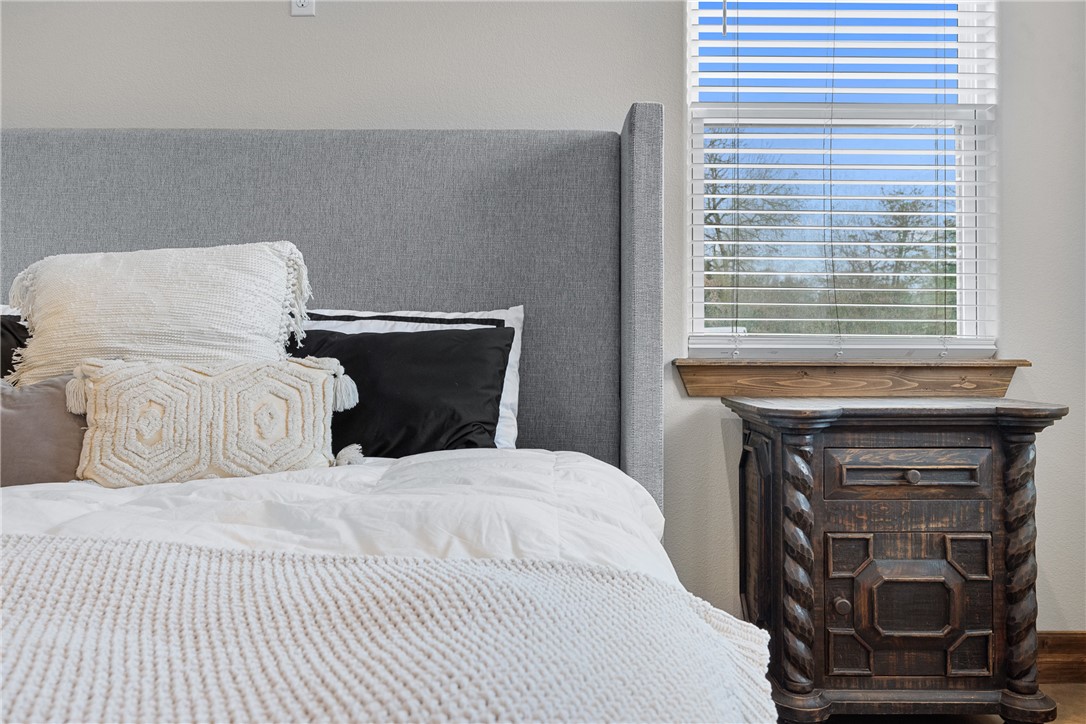 7440 Fm 39 Road South North Zulch, TX 77872 - Photo 22 of 50 a bedroom with a bed and a window