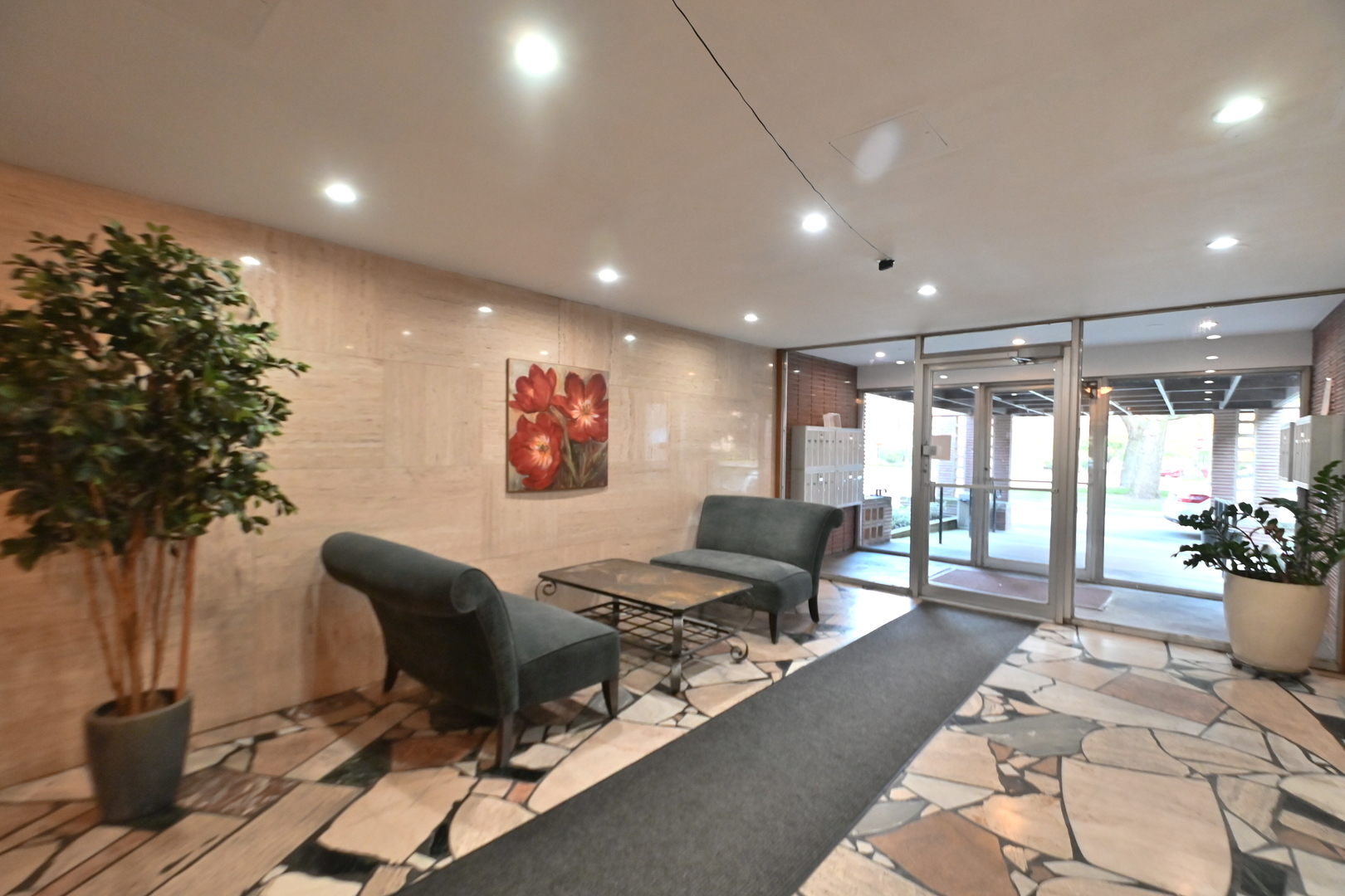 200 Ridge Avenue, Unit 1E Evanston, IL 60202 - Photo 3 of 13 a living room with furniture a potted plant and a large window