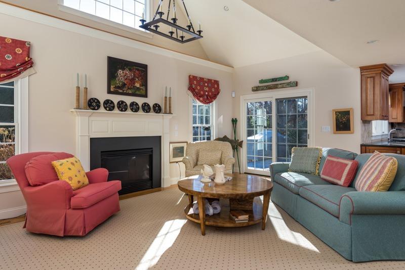91 Great Bay Road Osterville, MA 02655 - Photo 12 of 27 a living room with furniture a chandelier and a fireplace